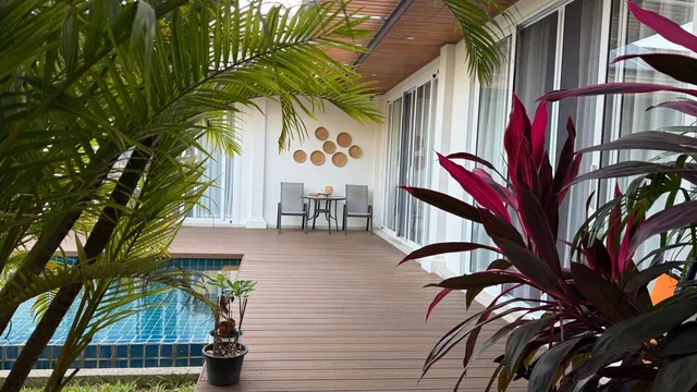 The pool deck and the sliding doors of the house