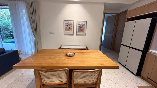 The dining table and the doors to the pool