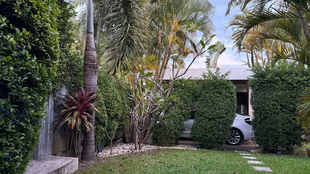 The garden, with the covered parking behind it